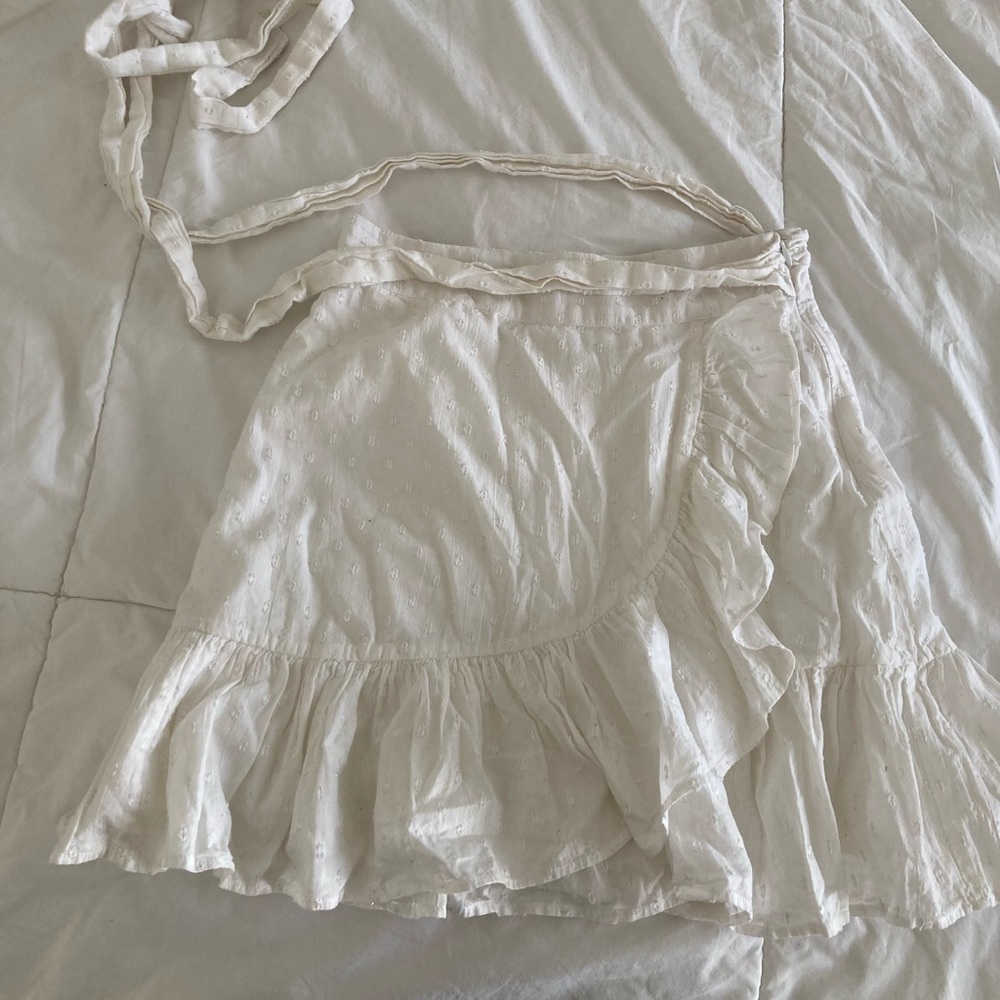 White eyelet ruffle tie skirt by Tularosa